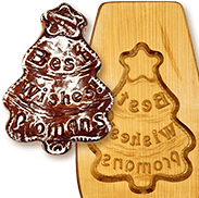 печатный тульский пряник в форме новогодней ёлки с надписями и его резная деревянная форма